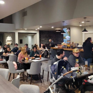 Diners enjoying dinner and drinks inside the Taphouse restaurant