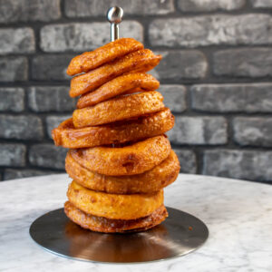 Stack of onion rings on skewer