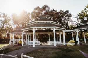 Gazebo set up with white folding chairs