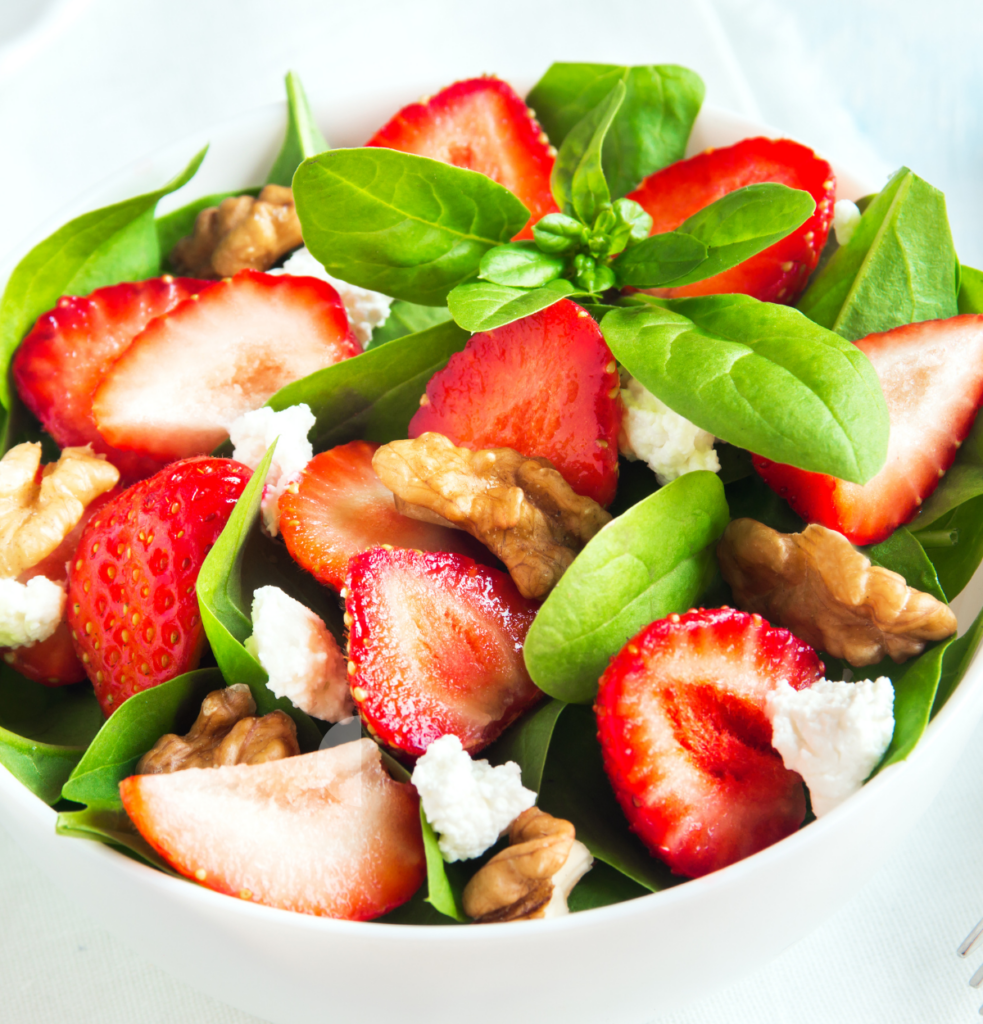 Salad with mixed greens, strawberries, pecans and goat cheese